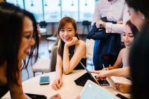 coworkers smiling around table